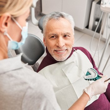 A patient receiving dental impressions for dentures